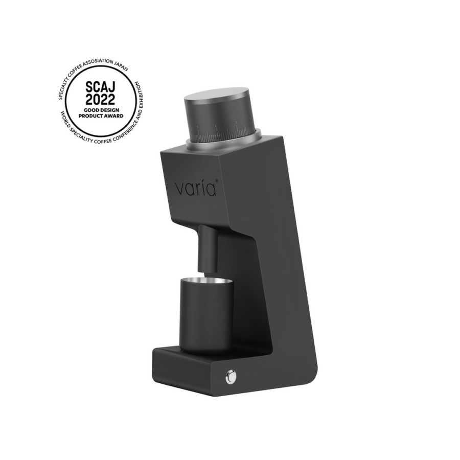 Black matte coffee grinder with cup.